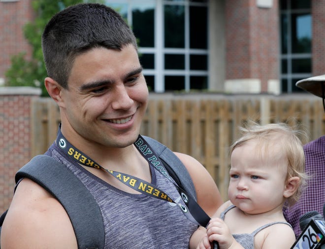 Packers linebacker Blake Martinez holds his baby daughter Kinsley as he talks to media outside Victor McCormick Hall at St. Norbert College Tuesday, July 23, 2019, in De Pere, Wis.