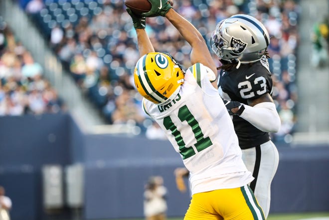 Aug 22, 2019; Winnipeg, Manitoba, CAN; Green Bay Packers wide receiver Trevor Davis (11) catches a touchdown pass against Oakland Raiders cornerback Nick Nelson (23) during the second quarter at Investors Group Field.