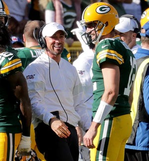 Green Bay Packers quarterback Aaron Rodgers (12) celebrates his 74 yard touchdown pass to Marquez Valdes-Scantling with Green Bay Packers head coach Matt LaFleur during the 4th quarter of the Green Bay Packers 42-24 win over the Oakland Raiders at Lambeau Field in Green Bay  on Sunday, Oct. 20, 2019.  Photo by Mike De Sisti/Milwaukee Journal Sentinel