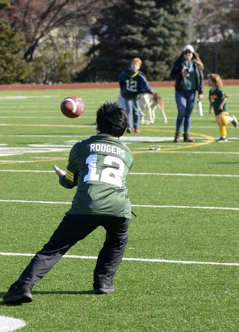 Ryo "Jom" Kato the Japanese Packers Cheering Team attempts to catch a pass on Nov. 9, 2019 at Green Bay East High School.