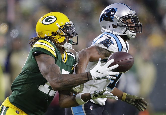 Green Bay Packers wide receiver Davante Adams (17) pulls down a long first down reception against Carolina Panthers defensive back Ross Cockrell (47) in the second quarter Sunday, November 10, 2019, at Lambeau Field in Green Bay, Wis.