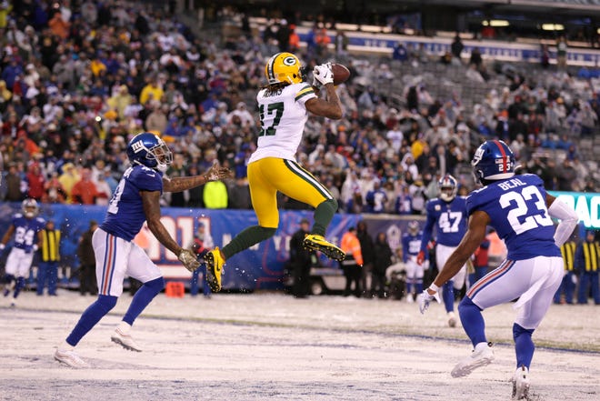 Green Bay Packers' Davante Adams (17) catches a touchdown pass during the second half of an NFL football game against the New York Giants, Sunday, Dec. 1, 2019, in East Rutherford, N.J. (AP Photo/Adam Hunger)