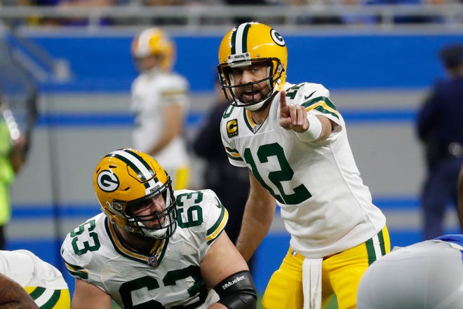 Green Bay Packers quarterback Aaron Rodgers calls out signals during the first half of an NFL football game against the Detroit Lions, Sunday, Dec. 29, 2019, in Detroit.