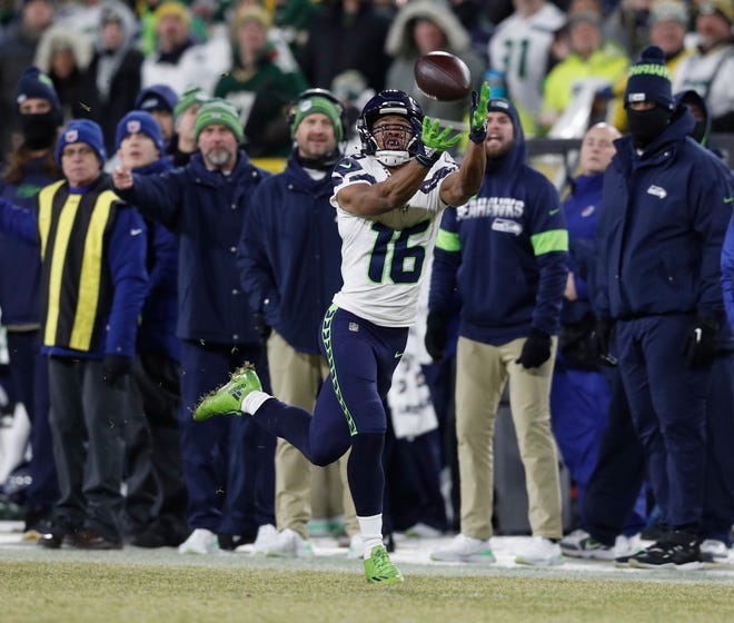 Seattle Seahawks wide receiver Tyler Lockett (16) catches a pass against the Green Bay Packers in the first quarter of a NFC Divisional Round playoff football game at Lambeau Field on Sunday, January 12, 2020 in Green Bay, Wis.