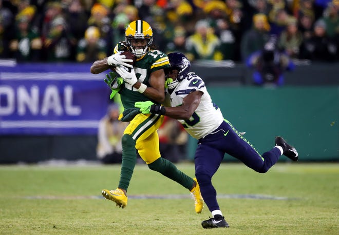 Davante Adams #17 of the Green Bay Packers makes a reception during the fourth quarter against the Seattle Seahawks in the NFC Divisional Playoff game at Lambeau Field on January 12, 2020 in Green Bay, Wisconsin.