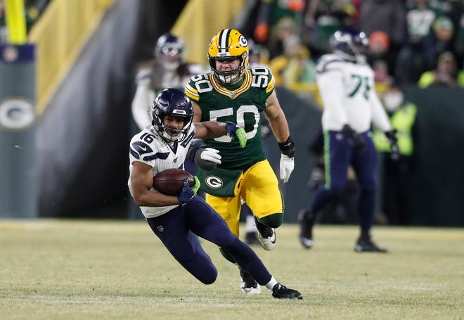 Seattle Seahawks wide receiver Tyler Lockett (16) runs the ball past Green Bay Packers inside linebacker Blake Martinez (50) in the second quarter of a NFC Divisional Round playoff football game at Lambeau Field on Sunday,  January 12, 2020 in Green Bay, Wis.