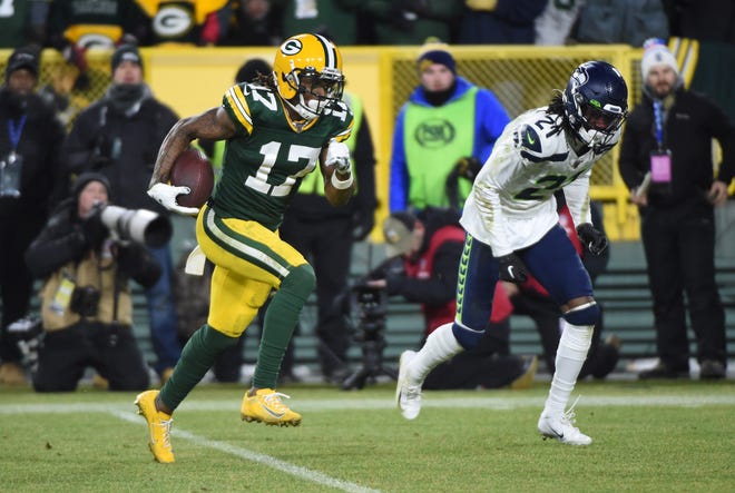 Green Bay Packers wide receiver Davante Adams (17) scores a touchdown against the Seattle Seahawks in the third quarter of a NFC Divisional Round playoff football game on Sunday, January 12, 2020, at Lambeau Field in Green Bay, Wis.