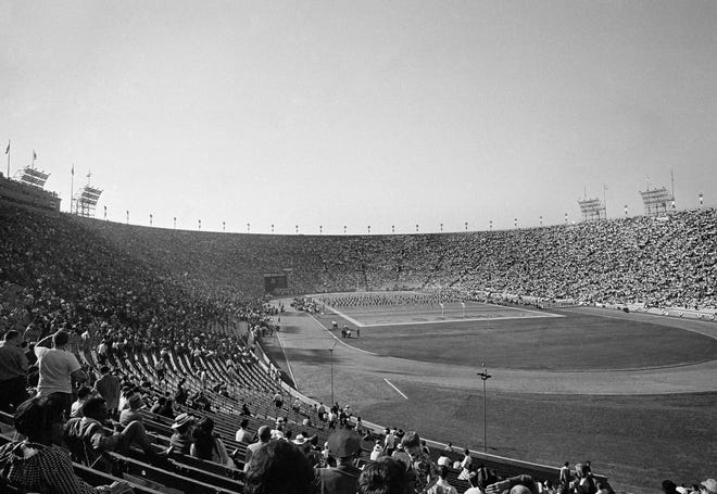 In this Jan. 15, 1967, file photo, thousands of fans attend the first AFL-NFL World Championship Game, now known as Super Bowl I, between the Green Bay Packers and the Kansas City Chiefs in Los Angeles. Green Bay's proven old pros carried the National Football League to a 35-10 victory over the Chiefs of the American Football League in the first Super Bowl under the brilliant direction of quarterback Bart Starr.