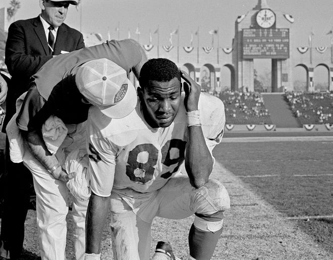 Otis Taylor of the Kansas City Chiefs gets some comforting words from the assistant coach on the sidelines during the Super Bowl at the Los Angeles Memorial Coliseum in Los Angeles, Calif., Jan. 15, 1967. Taylor is one of the stars of the Chiefs, but the Green Bay Packers won the game 35-10.