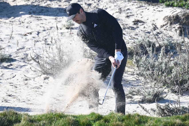 Aaron Rodgers hits out of the sand on the third hole during the first round of the AT&T Pebble Beach Pro-Am golf tournament at Spyglass Hill Golf Course on Feb. 6, 2020, in Pebble Beach, California.