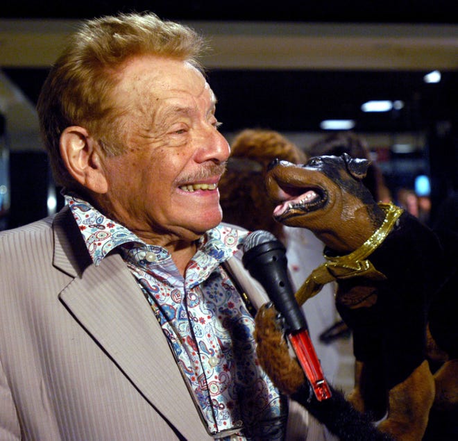 Jerry Stiller jokes with Triumph the Insult Comic Dog, of Late Night with Conan O'Brien, following a panel discussion entitled Arts, Education and the 21st Century Economy, sponsored by the Creative Coalition July 27, 2004 in Boston, Mass.