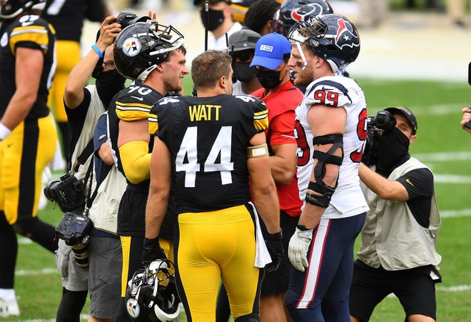 T.J. Watt and Derek Watt of the Pittsburgh Steelers and J.J. Watt of the Houston Texans talk after Pittsburgh's 28-21 win on Sept. 27, 2020, at Heinz Field in Pittsburgh. It was only the third time ever that three brothers have played in the same NFL game. With J.J. announcing on Friday that he and the Texans are parting ways after 10 years, could a reunion in Pittsburgh be in store for the Watt brothers?