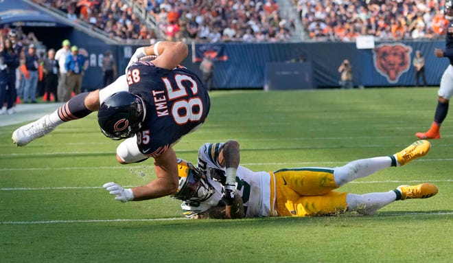 Green Bay Packers cornerback Jaire Alexander (23) trips up Chicago Bears tight end Cole Kmet (85) near the goal line during second quarter of their game on Sunday, Sept. 10, 2023 at Soldier Field in Chicago.