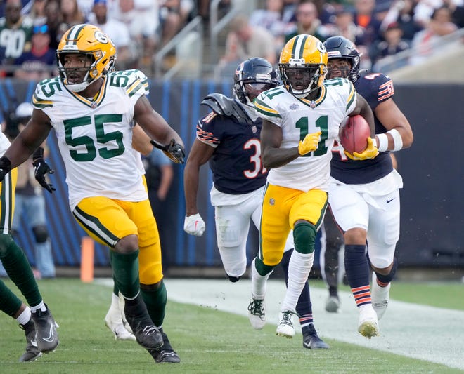 Green Bay Packers wide receiver Jayden Reed (11) makes a long punt return during second half of their game against the Chicago Bears on Sunday, Sept. 10, 2023 at Soldier Field in Chicago.