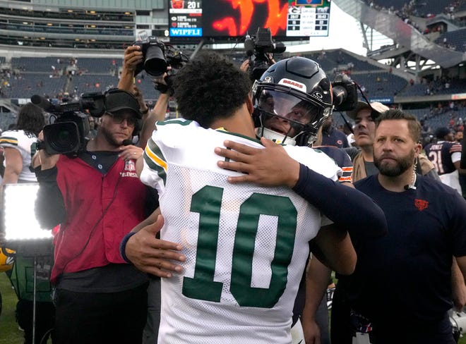 Chicago Bears quarterback Justin Fields (1) hugs Green Bay Packers quarterback Jordan Love (10) after their 38-20 win on Sunday, Sept. 10, 2023 at Soldier Field in Chicago.
